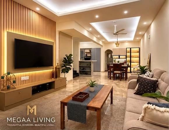Living room with a backlit fluted TV wall, low wooden console, cove-lit false ceiling and an open dining area beyond
